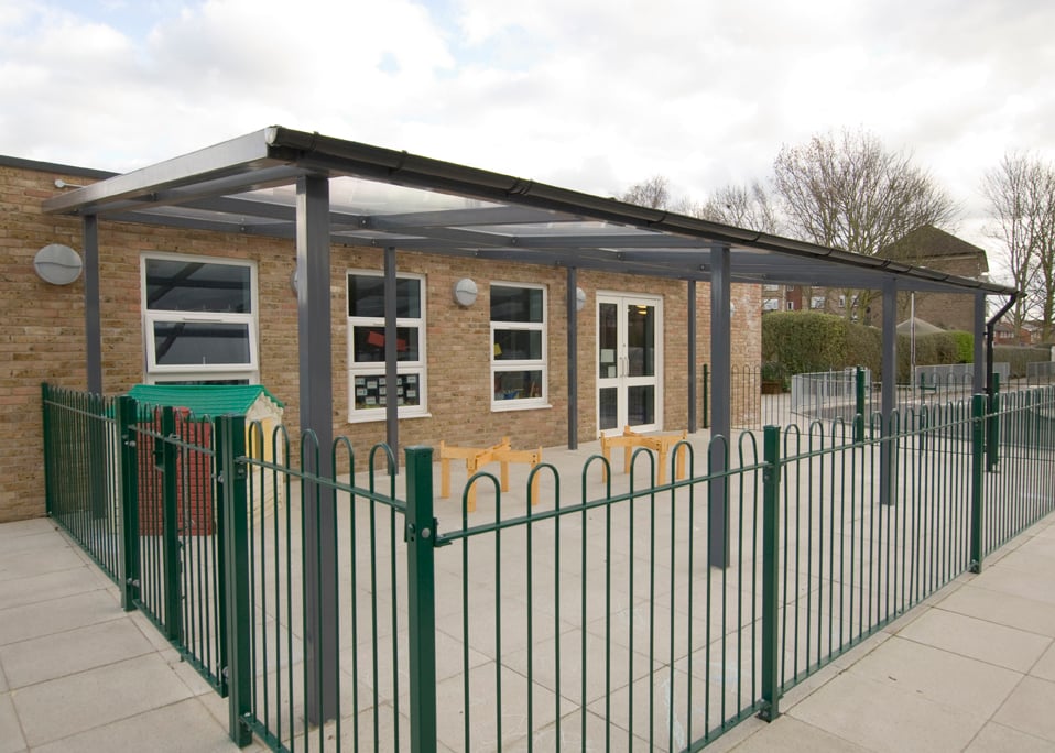 Image of a black shelter store walkway canopy installed at a school